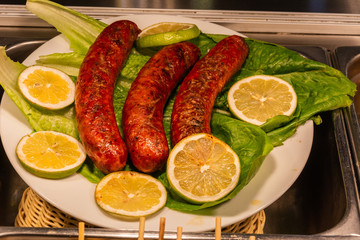 Greek loukaniko sausages with lemon.