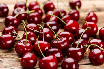 Sweet cherries on brown wooden table