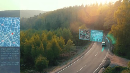 Self Driving car driving on a forest highway with technology assistant tracking information, showing details. Visual effects clip