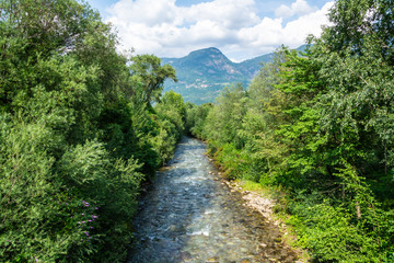 Fototapeta na wymiar Mountain creek running in Lana municipality in South Tyrol, Italy.