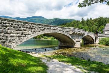 Fototapeta na wymiar Bridge spanning Sava Bohinjka river in Slovenia