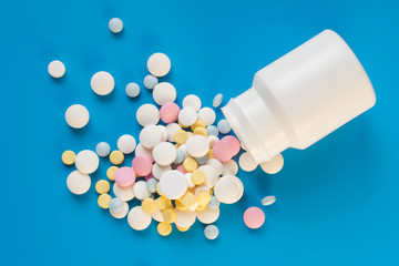 Tablets to maintain the correct functioning of the human cardiovascular system on a blue background