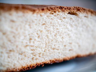 Porous white bread in the cut. Close-up.