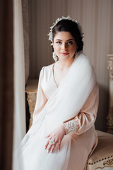 Beautiful bride portrait wedding makeup and hairstyle, girl in diamonds tiara and marriage robe,...