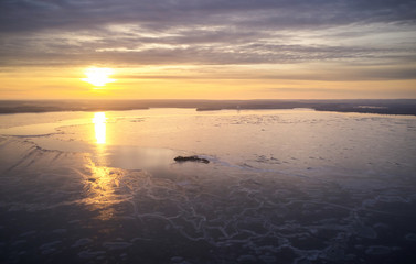 Dusk at frozen lake