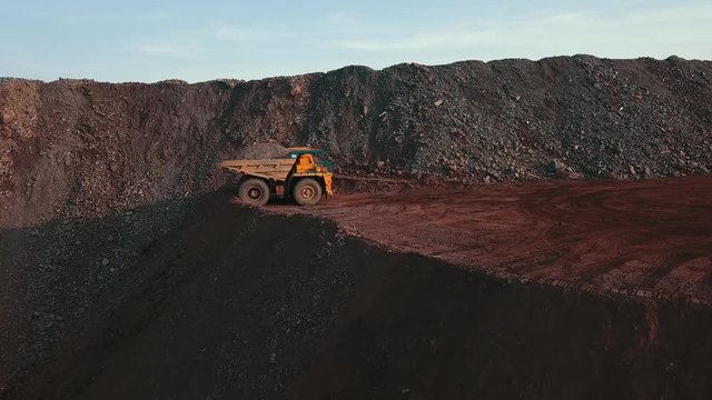 huge trucks dump trucks mining trucks ore transportation iron quarry open cast iron ore