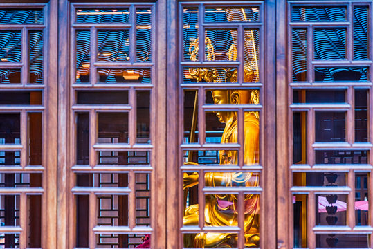 A golden buddha at Shanghai's Jade Buddha Temple - Powered by Adobe