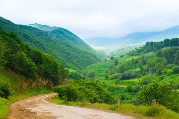 Fototapeta na wymiar Landscapes of Armenia in June, view of green mountains in cloudy weather