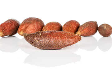Group of seven whole exotic brown salak isolated on white background