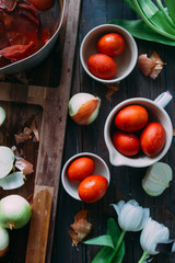Dyeing eggs for Easter holidays, coloring with different color and tonality using natural food dye...