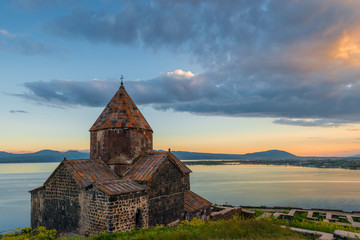 Black clouds at sunset, dramatic sky, view of Sevanavank Monastery and Lake Sevan, Armenia