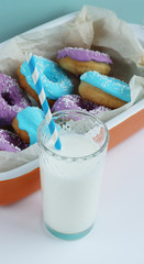 multicolored donuts in a basket with icing, top view, side view