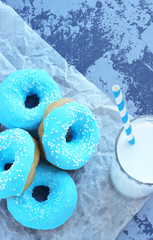 multicolored donuts lie on a mesh background