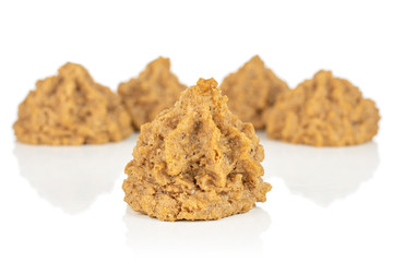 Group of five whole homemade brown coconut biscuit with chocolate isolated on white background