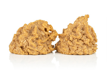 Group of two whole fresh homemade brown coconut biscuit with chocolate isolated on white background