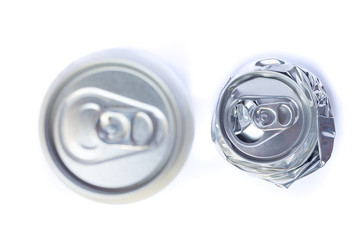 Top view close up of two silver aluminum cans isolated on white background, selective focus and unpainted. Concept of drinks, industry, soda, beer, model, manufactures, recycling and object.