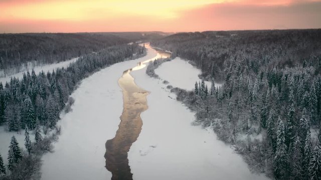 Aerial view river valley on the background of sunset in winter