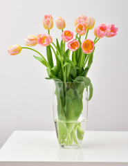 Bright spring bouquet in a vase. Springtime. Vase with tulips.