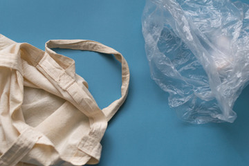 Eco friendly friend's bag for linen products on a blue background against a plastic bag.