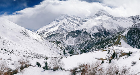 Annapurna Circuit track. Spring Himalayan landscape. Outskirts of Manang village, Nepal.