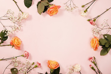Arrangement of flowers on a pink isolated background, place for text, flat lay. Creative modern bouquet, minimal holiday concept. Greeting card for Women's Day or Valentine's Day, happy birthday, 