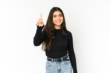 Young indian woman isolated on purple background showing number one with finger.