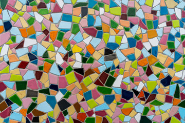 Pattern texture of colorful small mosaic tiles on the wall