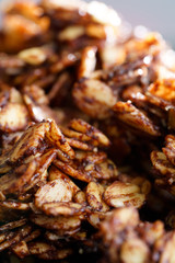 Macro shot of homemade cocoa granola with crunchy peanuts and maple syrup. Morning light, high resolution