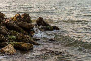 Stacked big stone boulders on the seashore