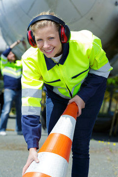 female airport ground worker smiling