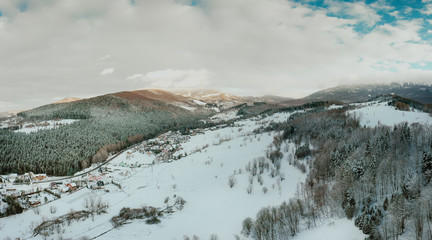 View of small village in mountains in winter