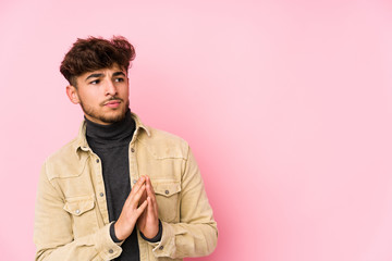 Young arabian man posing in a background isolated making up plan in mind, setting up an idea.