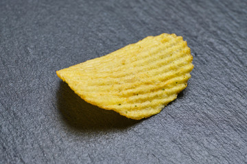 One grooved chip on a slate.