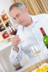man tasting wine in a restaurant