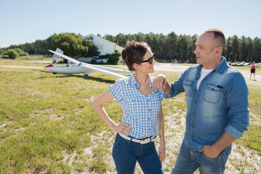 Middle Aged Couple At An Airfield