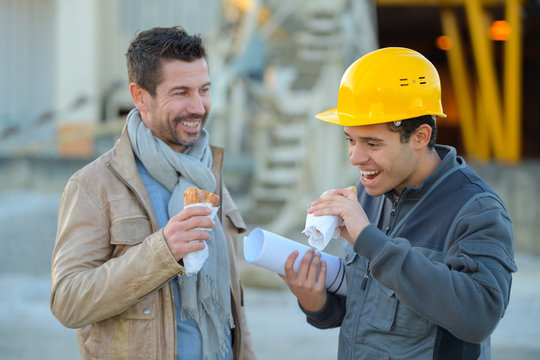 Builders Laughing While Having A Lunch Break