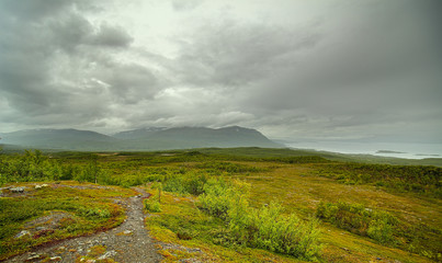 Fototapeta na wymiar View from the hill paddus at Mount Nuolja and Lake Tornetrask near Abisko, Sweden