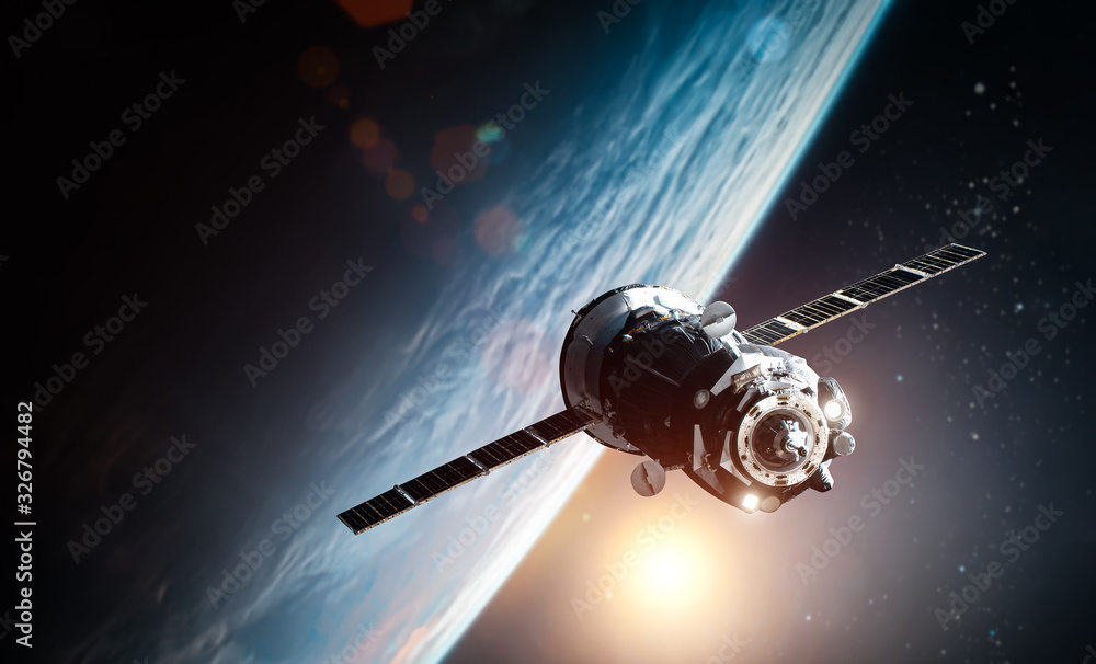 Fototapete Spaceship near Earth planet in the outer space. Sun and stars on background. Elements of this image furnished by NASA.