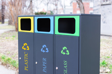 Modern colorful refuse bins for separate trash.