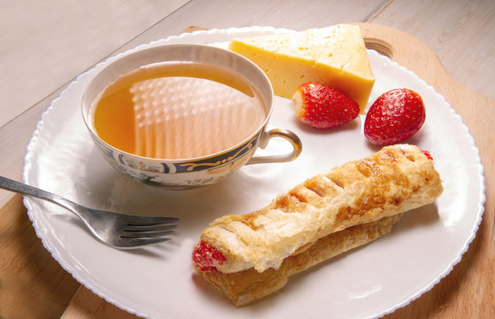 strudel strip and chease and tea cup