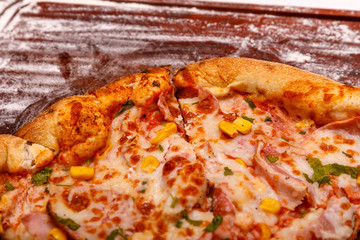 Delicious italian pizza served on wooden table. Pizza Italian Fastfood Cooking Kitchen.