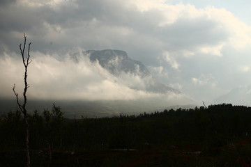 Obraz premium High contrast shot of landscape at Katterjakk in northern Sweden. The mountain Vassecohka can be seen