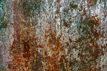 Rough and battered green paint texture on a rusted metal surface showing scratches, dents and rust patches