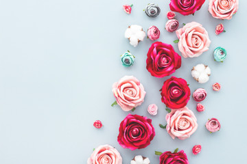 Flowers on blue background, flat lay, top view