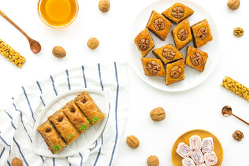 Arabic sweets on white background, flat lay, top view