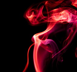Obraz premium Red smoke on black background