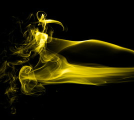 Yellow smoke on black background