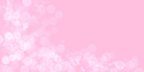 Bokeh balls on pink background with copy space for your text or image.