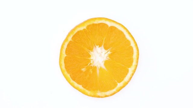 Fresh citrus sliced orange rotating. Spinning sliced orange - Close up stop motion 