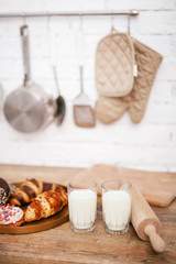 composition of donuts and milk in the kitchen